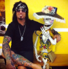 nikki sixx arm and leg tattoo